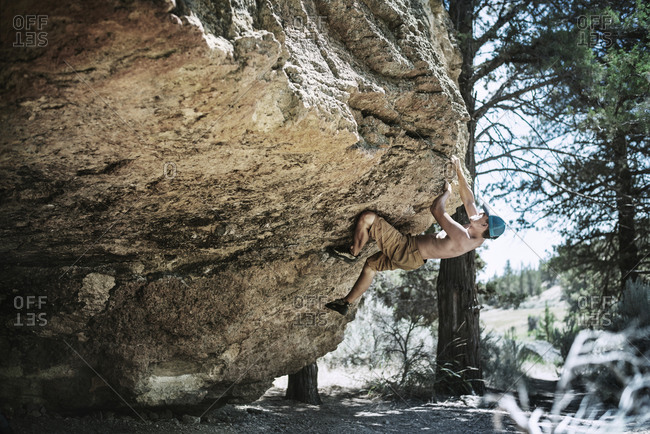 Man climbing the side of a rock face