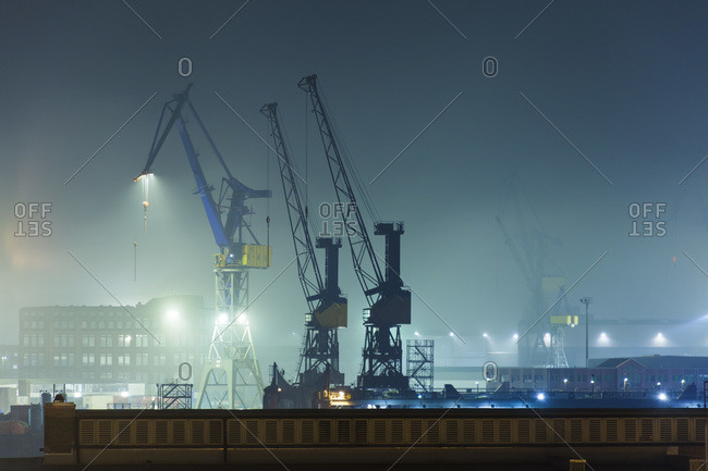 Harbor cranes at Port of Hamburg by night, Hamburg