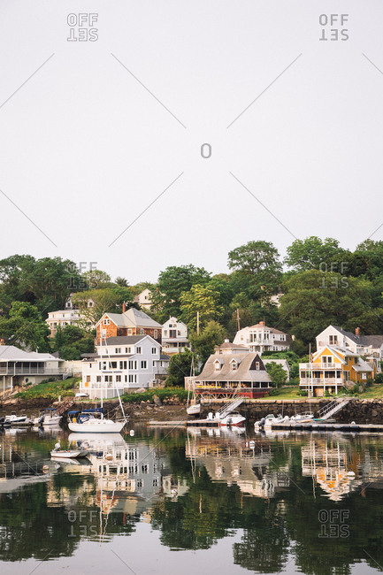 Houses, boats, and docks at Lobster Cove, Massachusetts at magic hour