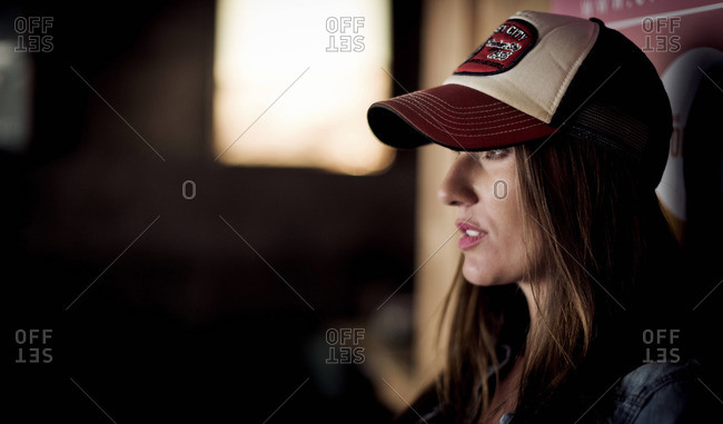 Young woman wearing a trucker cap