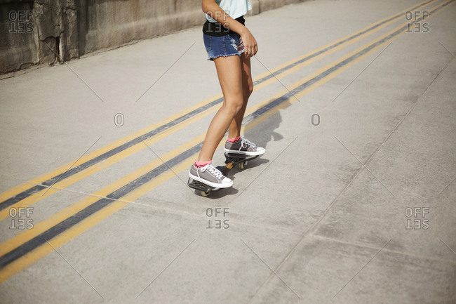 Girl riding on a caster board