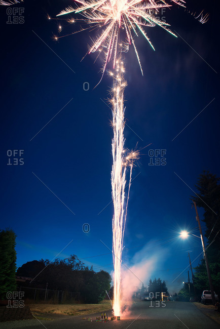 Small scale fireworks setting off from a street
