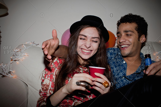 Friends laughing together at a party