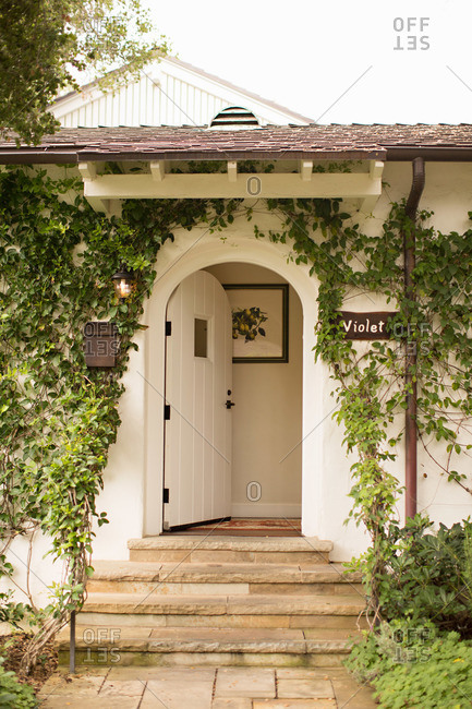 An open door leading into a country cottage