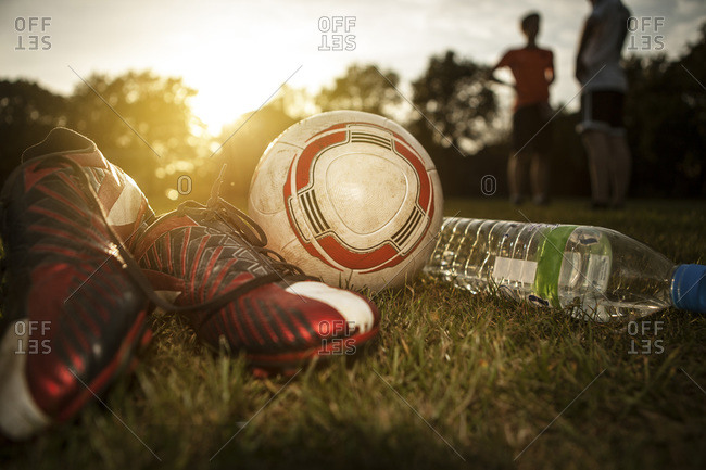 Ball and bottle of water on soccer pitch