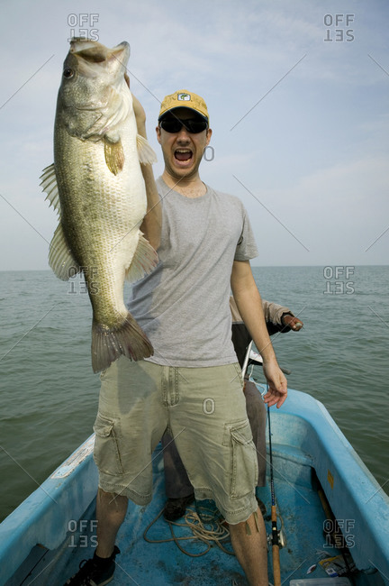 Excited man with a fish he just caught