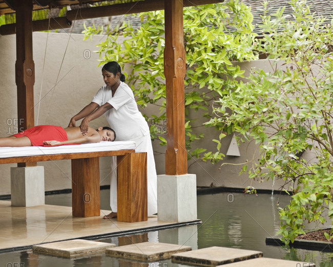 Woman receiving a massage in a luxurious spa