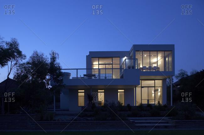 Rear elevation of a modern home at night in Kent, United Kingdom
