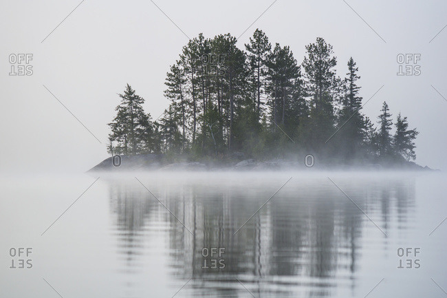 A Small Island With Trees Shrouded In Fog, Ontario, Canada