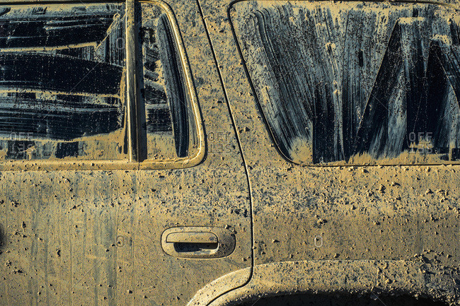 A vehicle covered in mud with windows smeared and wiped clean, Nevada, United States of America