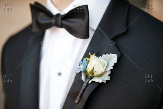 Close-up of groom in tuxedo with boutonniere