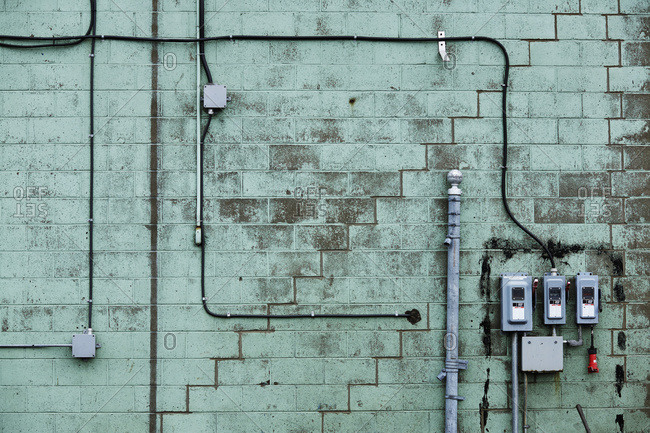 Green cinder block wall with wires, Bickerdike Port in Old Montreal, Montreal, Quebec, Canada