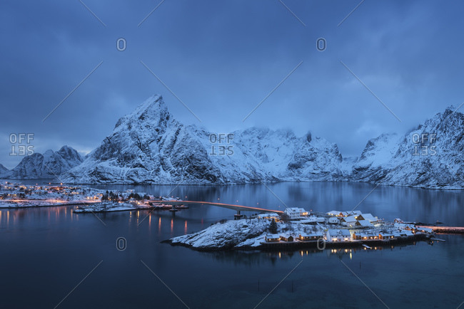Winter twilight view over rorbu cabins of Sakrisoy, Reine, Moskenesoy, Lofoten Islands, Norway