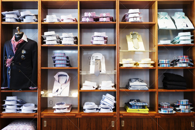 Selection of dress shirts and ties on shelves