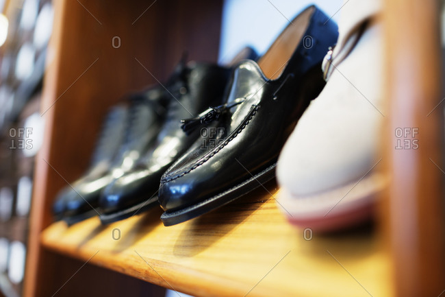 Variety of men\'s dress shoes on shelf