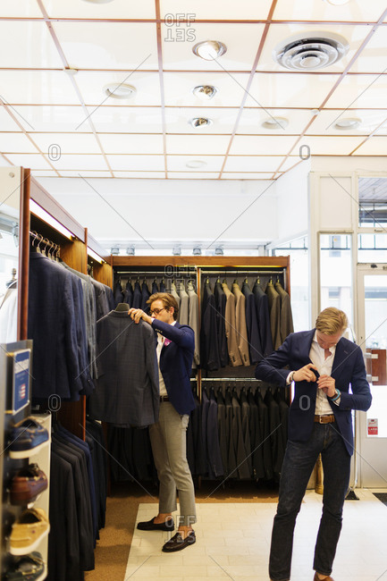 Two men in a suit store