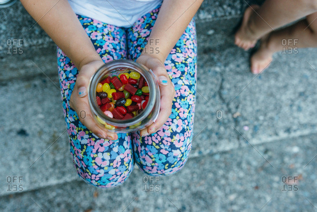 Girl holding a jar of jelly beans