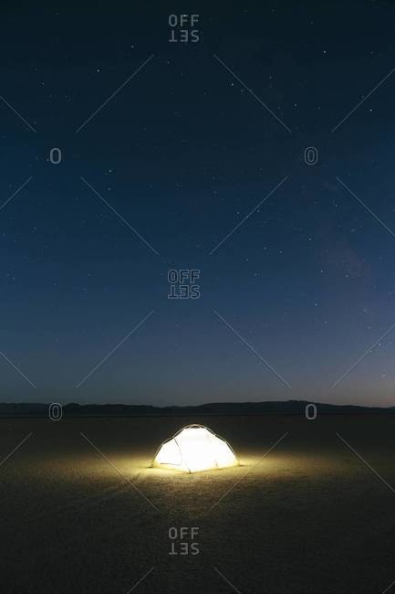 Illuminated campsite at night in Black Rock Desert, Nevada