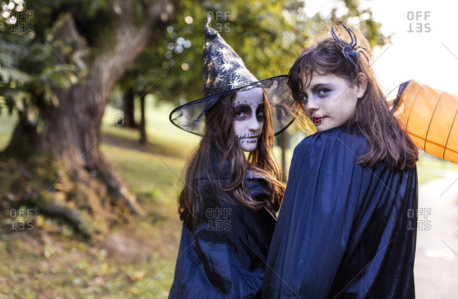 Portrait of two masquerade girls at Halloween