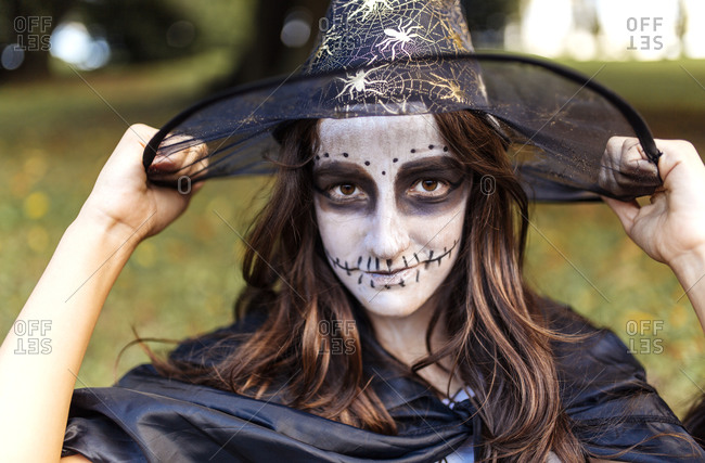 Portrait of masquerade girl at Halloween
