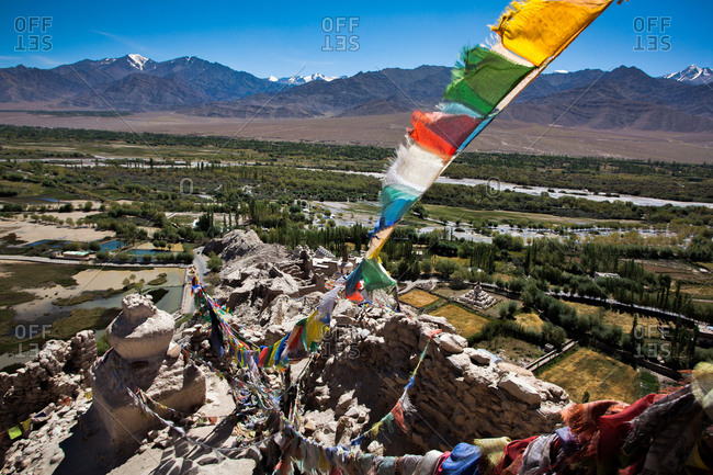 Prayer flags and view over Himalayan desert region