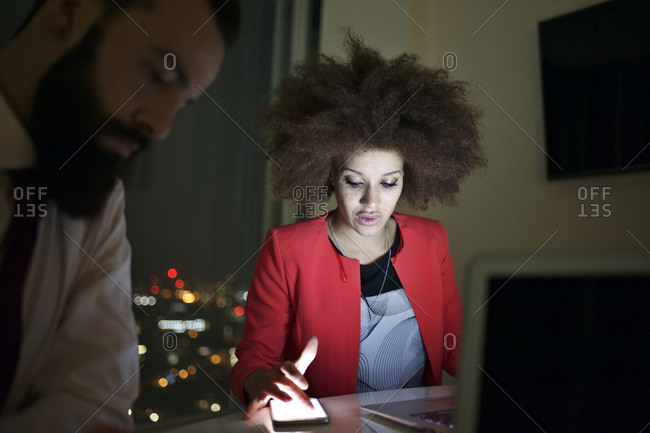 Young urban professionals working late