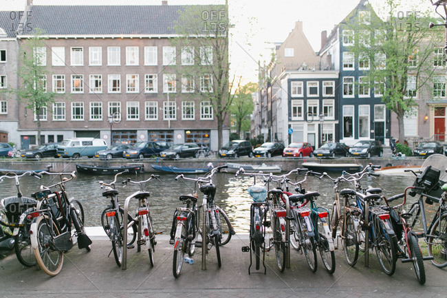Bicycles parked along the Singel Canal, Grachtengordel canal district of Amsterdam, Netherlands