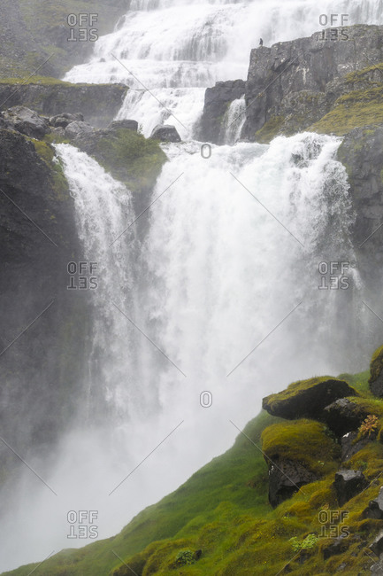 Dynjandi waterfall flowing in Iceland