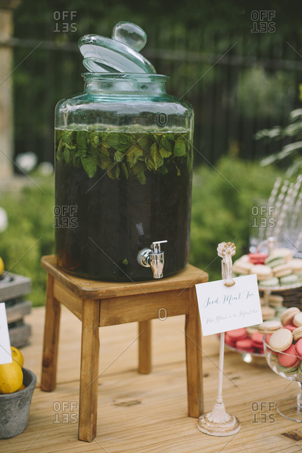 Refreshment dispenser and macaroons on wedding table