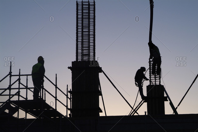 People working on an industrial construction site