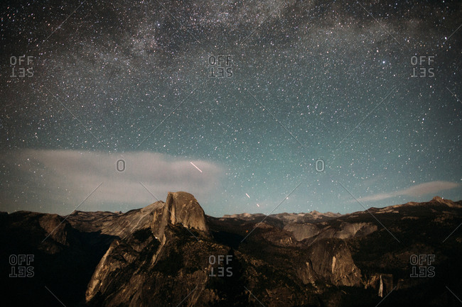 View of shooting stars and the milky way galaxy in the night sky