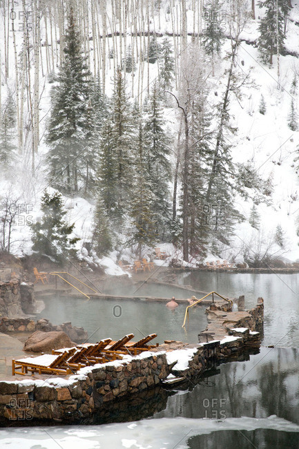 Tourists in a natural thermal pool in winter