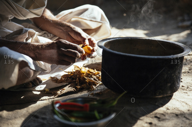 Indian holy man preparing dish