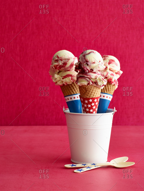 Three ice cream cones wrapped in star paper