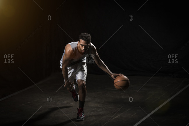 Athletic man dribbling a basketball