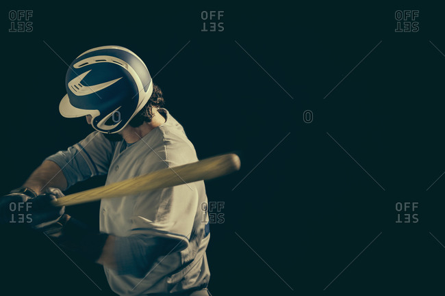 Baseball player swinging a baseball bat