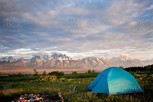 The sun rises over a campsite, Tetons, Wyoming