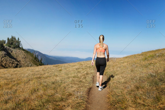 Athletic woman on mountain trail
