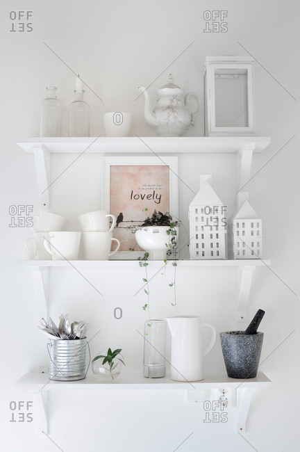 White ceramic ware on floating shelves