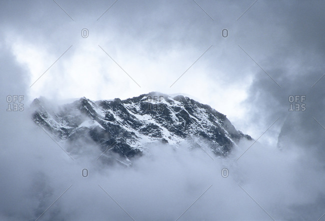 Mountain Top Seen through Fog
