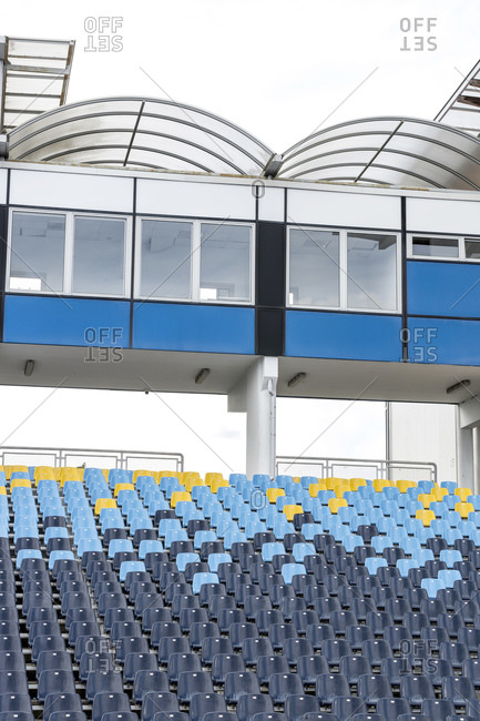 Empty grandstands and press box in stadium