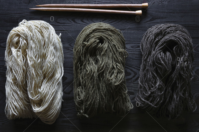 All-natural handspun yarn with knitting needles