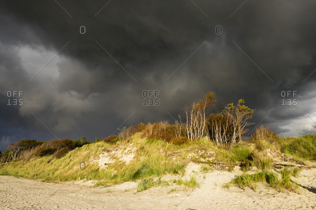 Rain clouds over Baltic Sea beach in Born auf dem Darss in Germany