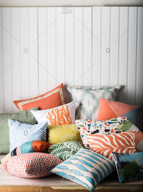 Pile of a variety of throw pillows
