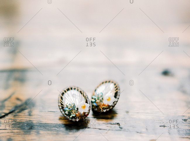 Close-up of vintage earrings with flower decorations