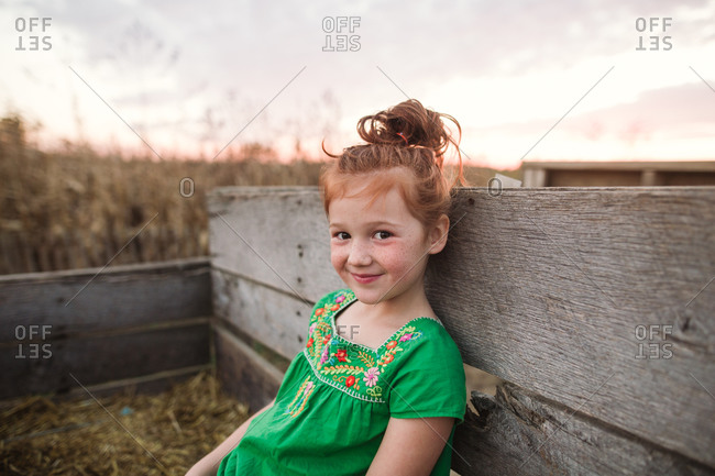 Little girl riding on a hay ride