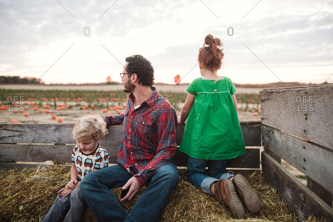 Father and kids riding on a hay ride