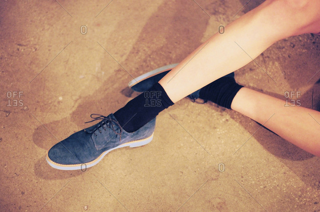 Person wearing blue suede oxford shoes