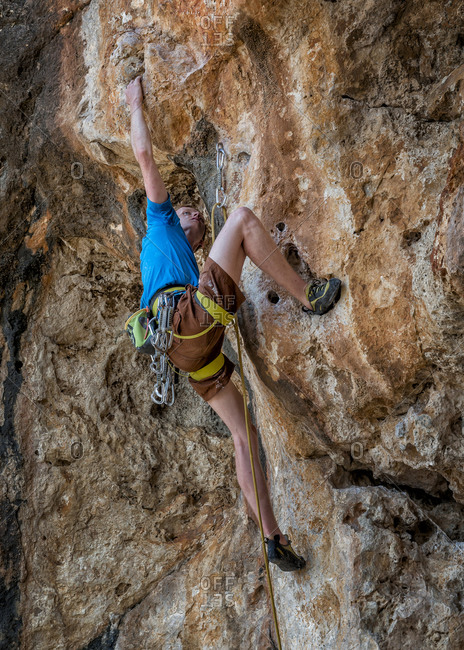 Rock climber in McCarthy\'s Cave in Malta