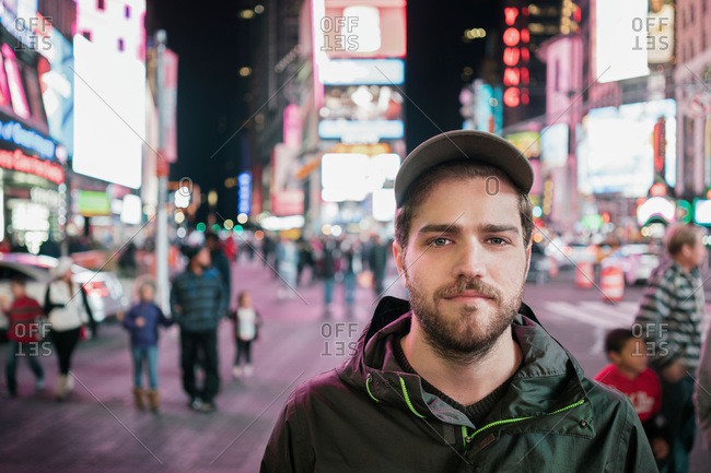 Portrait of a man standing in Times Square New York